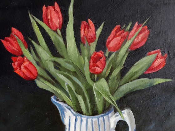 Tulips in blue and white jug
