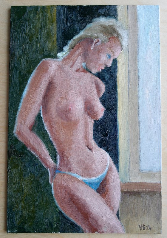 Female Figure Standing Near The Window