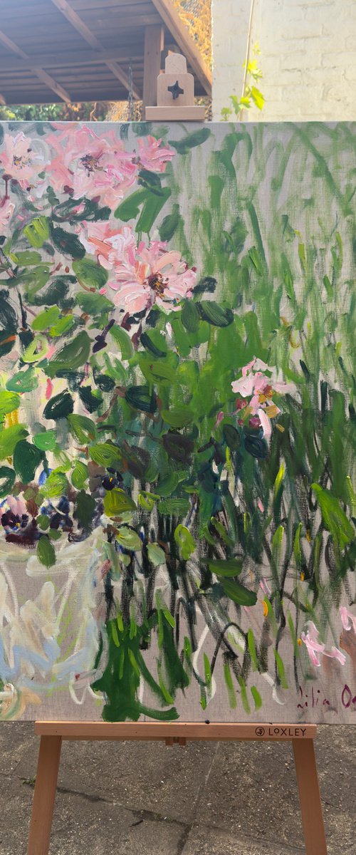Roses in a summer garden by Lilia Orlova-Holmes