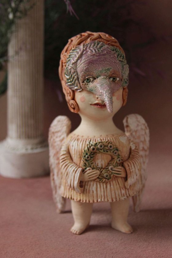 Angel holding a wreath. Ceramic OOAK sculpture.