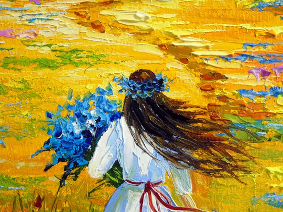 Woman Walking Through a Flower Field