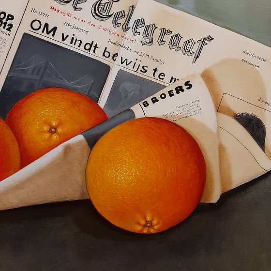 Newspaper De Telegraaf with oranges