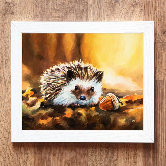 Hedgehog with acorn in fall