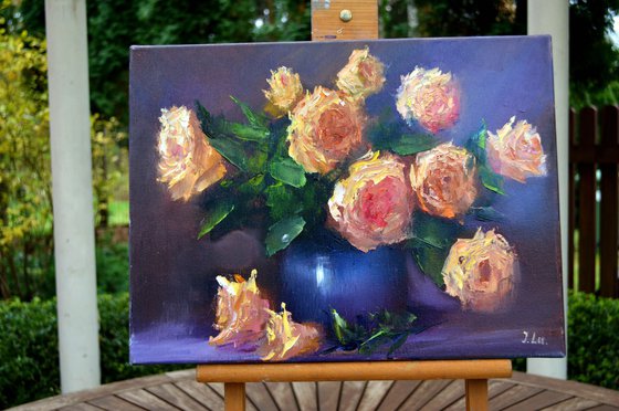 Yellow roses in a blue vase