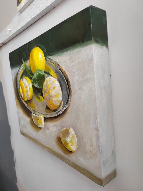 Lemon fruit slices on metal tray still life