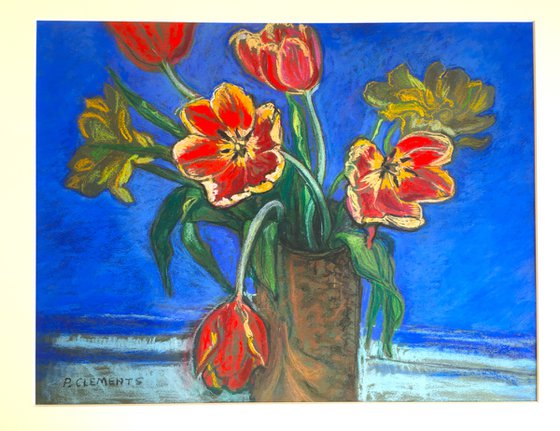 Red Tulips on a blue background