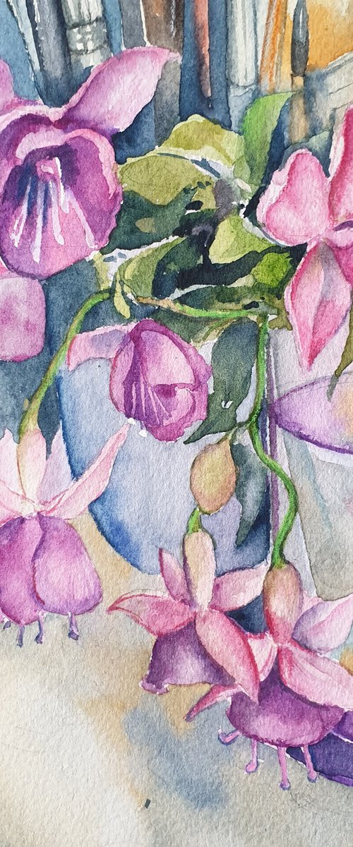Fushia flowers on painter's table by Ksenia June