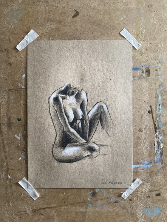 Nude sitting woman