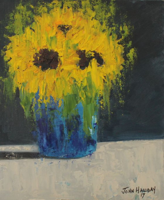 Sunflowers in blue vase