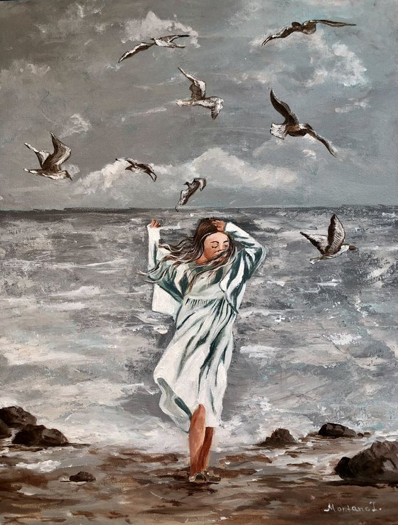 Girl and seagulls by the sea
