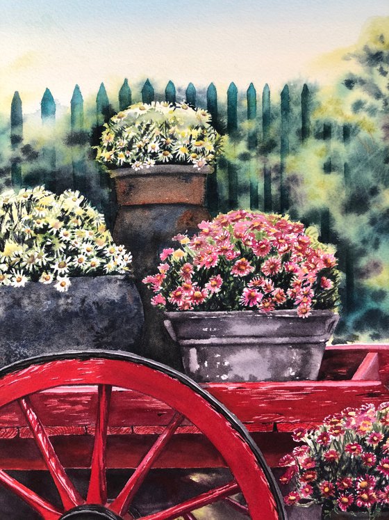 Old red cart with flowers