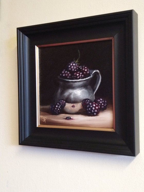 Silver cup with blackberries still life