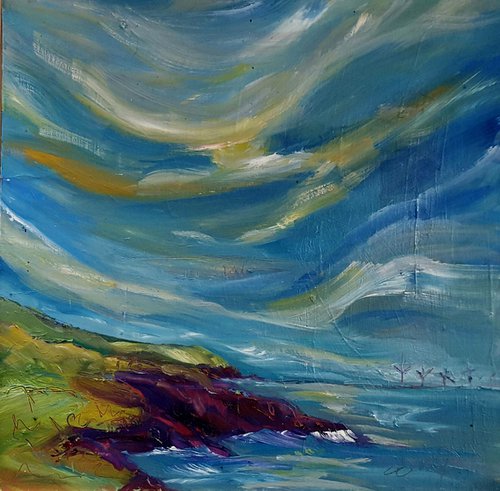Clouds dance over the land and out to sea while windmills turn by Niki Purcell