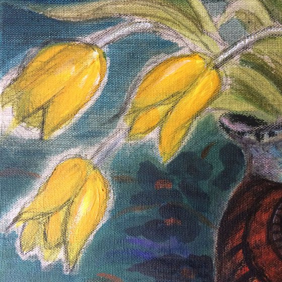Seven yellow tulips on a Liberty tablecloth