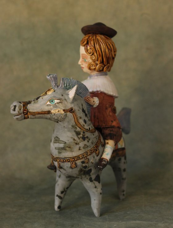 Vintage dressed boy riding the horse. From "Le Carousel, Hommage à l'Innocence" project by Elya Yalonetski