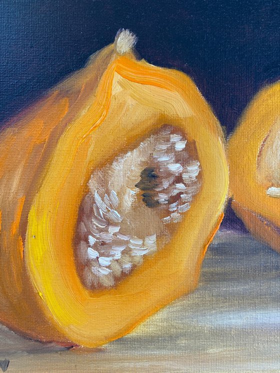 A small pumpkin cut in a half. still life