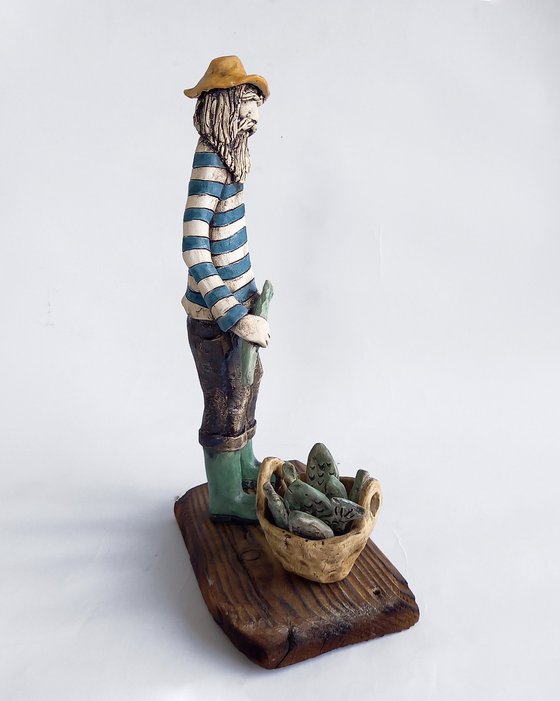 Good Cach (The Fisherman). Ceramic sculpture