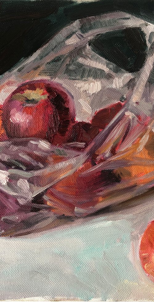 Red apples in plastic bag by Nataliia Nosyk