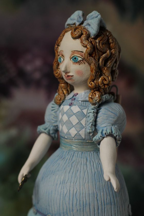 From the Alice in Wonderland. Alice as a little girl.  Wall sculpture by Elya Yalonetski