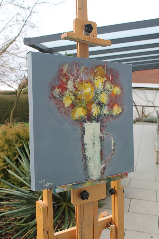 Flowers in a white jug.