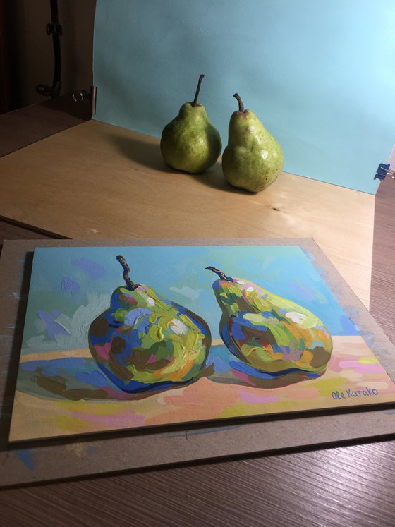 Two pears on a blue background