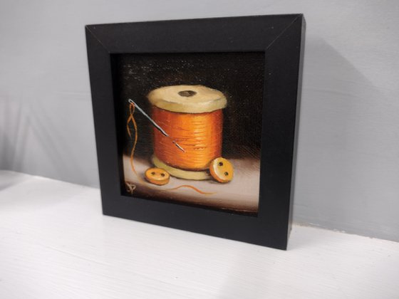 Little Orange  cotton reel  still life