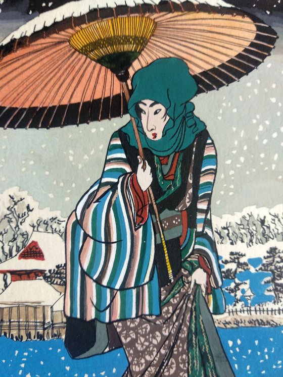 Young woman with umbrella and snow