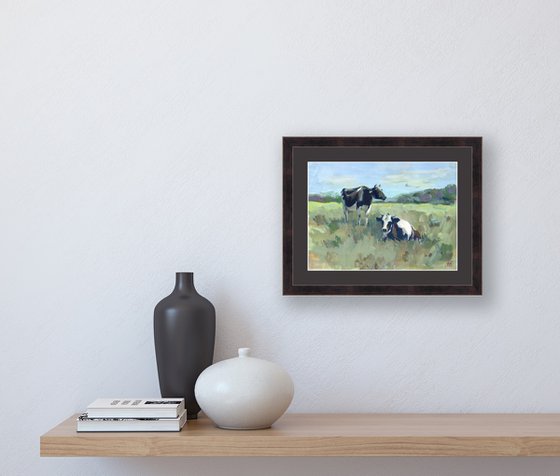 Black and white cows in the meadow, gouache painting