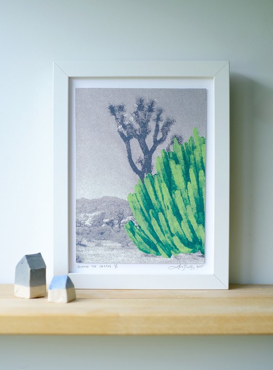 Behind the cactus