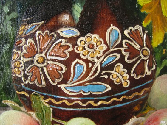 A bouquet of sunflowers in the Ukrainian ceramic jug