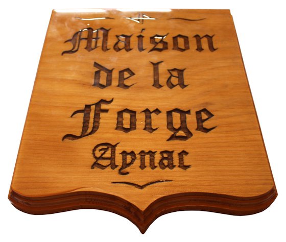 carved panel: House of the forge Aynac