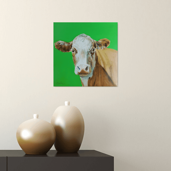 Portrait of a cow in green