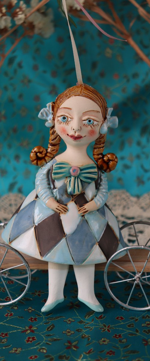 Little Girl in Blue Harlequine Dress. Tiny hanging sculpture by Elya Yalonetski