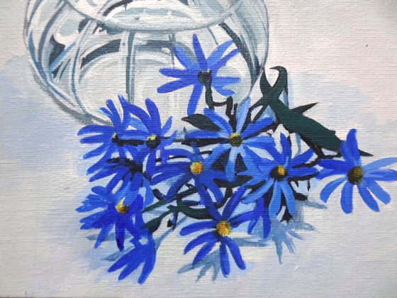 Blue Asters In A Glass Vase