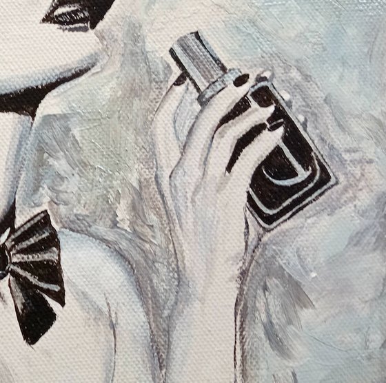 Woman with a bottle of perfume