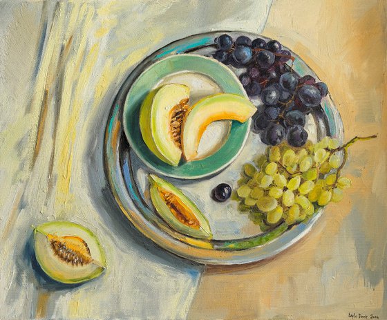 Melon slices with grapes