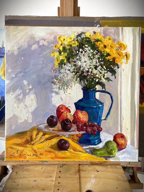 Still life with wildflowers and fruits