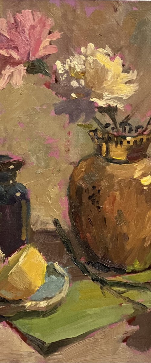 Copper vase and some lemons by Nithya Swaminathan