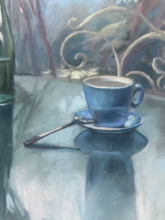 still life with a green bottle and a cup of coffee