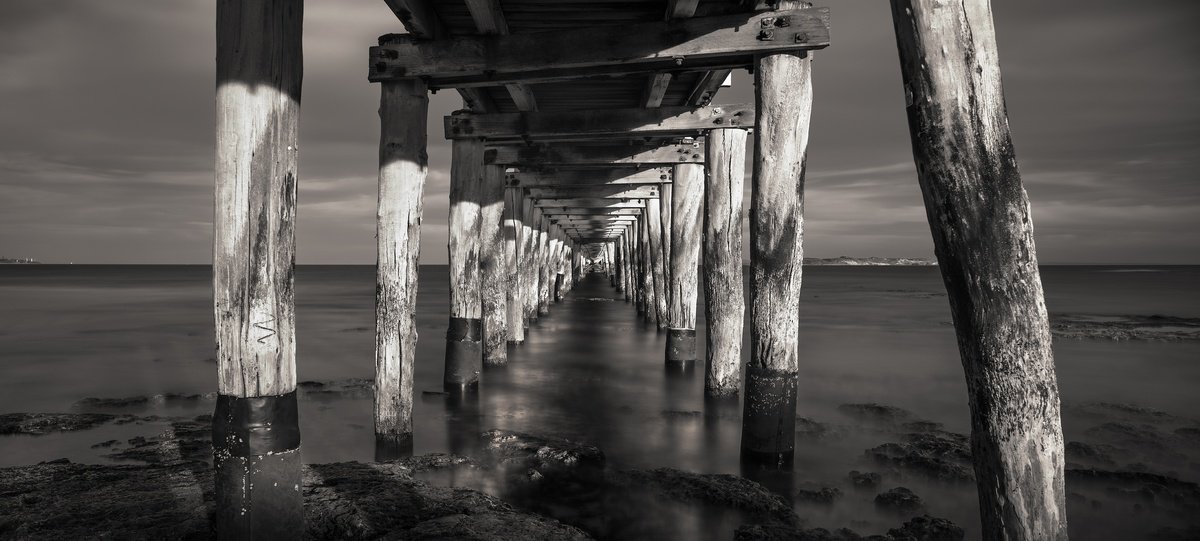 Tranquil Pier by Nick Psomiadis