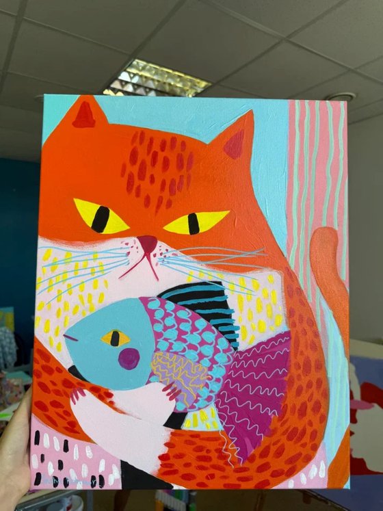 Orange Cat with Colorful Fish