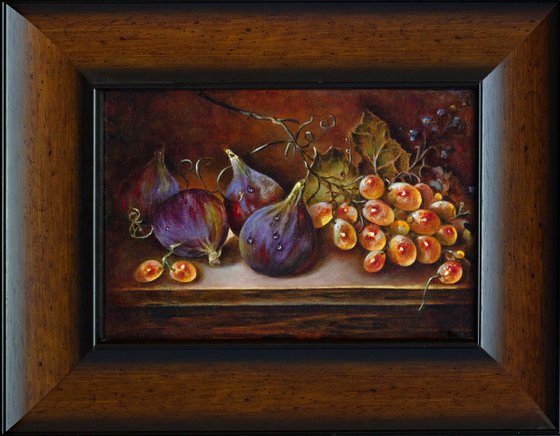 Still life with figs and a bunch of grapes