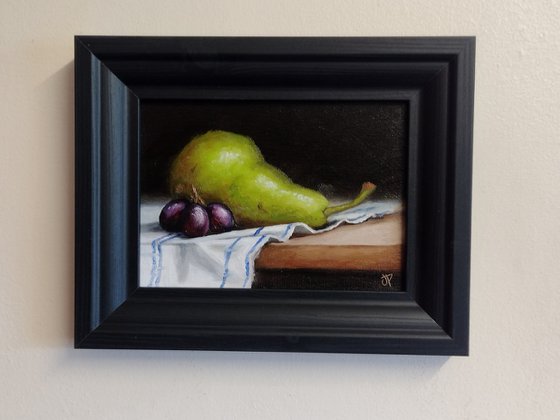 Pear on cloth still life