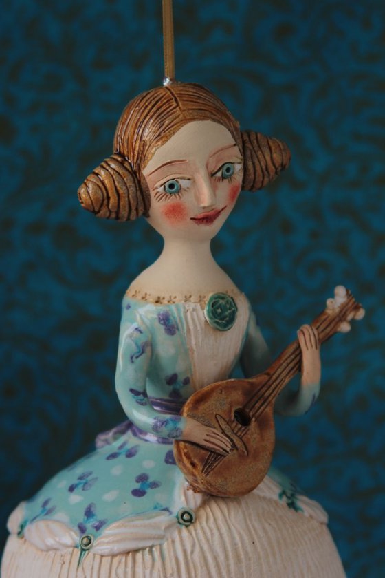 Girl with a mandoli. Ceramic hanging sculpture