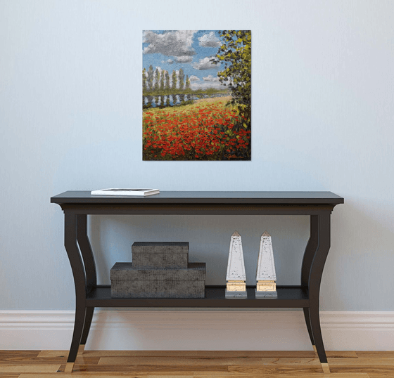 Poppy field by the river