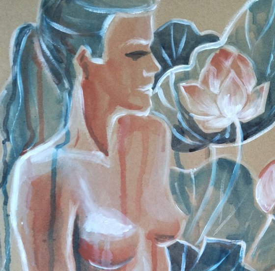 Naked woman in blooming water lilies