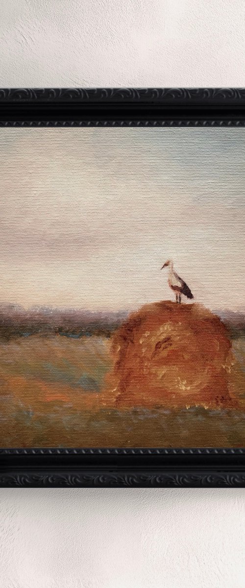 Stork on a haystack, in frame by Alena Post