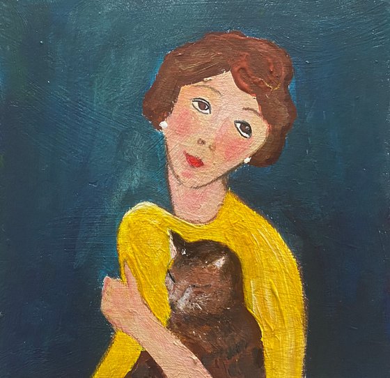 Woman yellow dress tabby cat