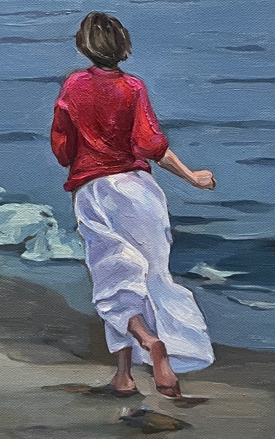 Girl and sea. Overcast weather