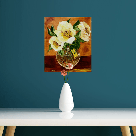 Bouquet of wild yellow roses in a vase on wooden table.